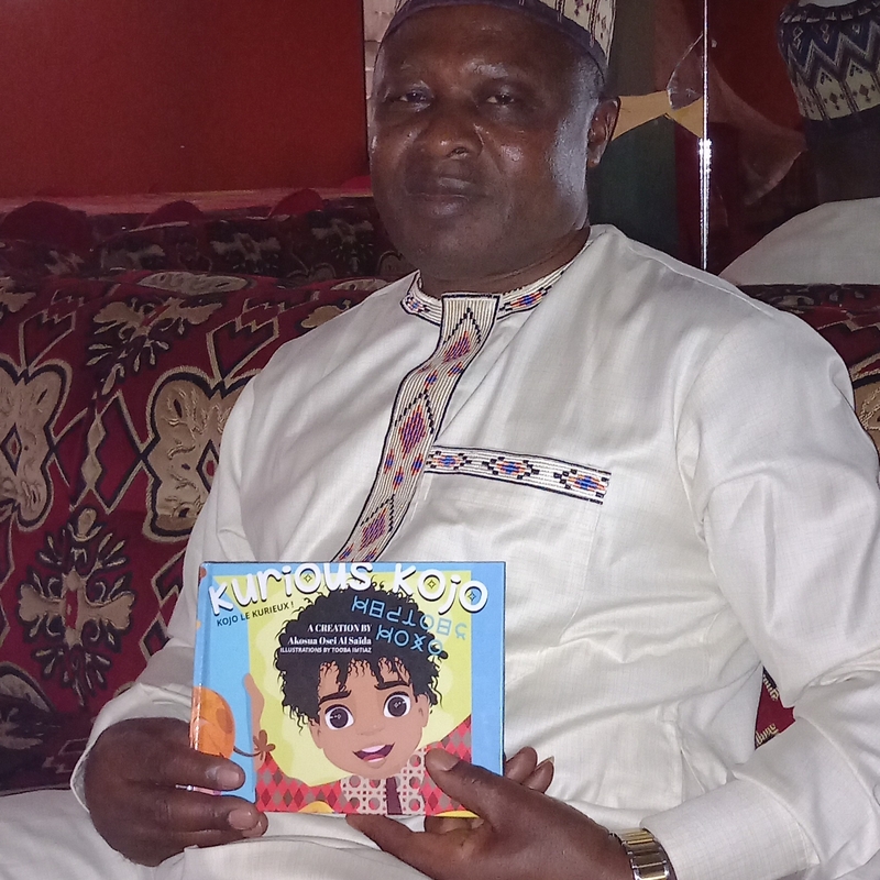 King of Bangoulap, West Cameroon with his copy of KURIOUS KOJO after discussion regarding educational tools and new programmes with Al Saïda Osei